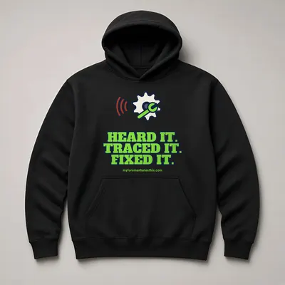 Mockup: Heard It. Traced It. Fixed It. on a black hoodie