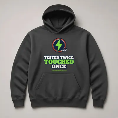 Mockup: Tested Twice, Touched Once on a charcoal hoodie